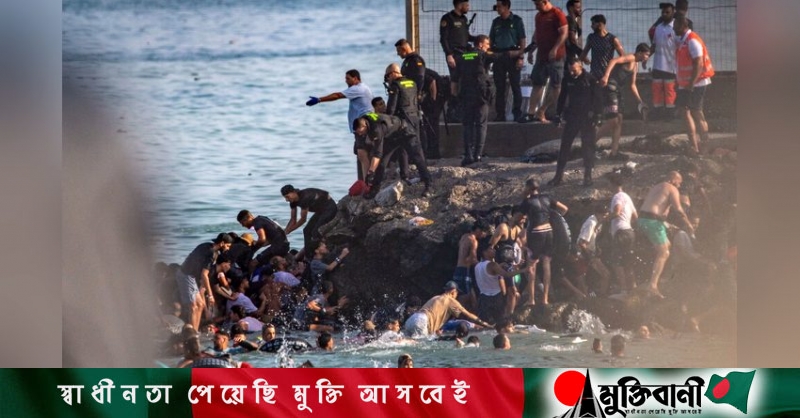 Spain sending troops as thousands enter enclave of Ceuta from Morocco
